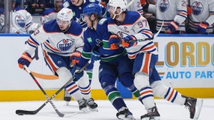 How do you stop a player like McDavid? By committee, Canucks say