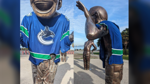 Canucks jerseys on Vancouver's laughing men statutes burned