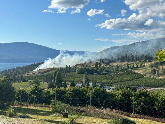 Residents say winds pushing grass fire in Lake Country