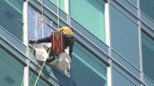 Portion of downtown Calgary street, sidewalk closed due to falling glass