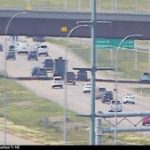 Wheel falls off trailer on Stoney Trail, striking windshield