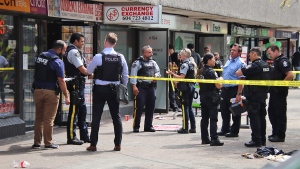 Suspect lit Surrey shopkeeper on fire, witness says