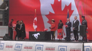 82 people receive citizenship at McMahon Stadium before Stampeders game