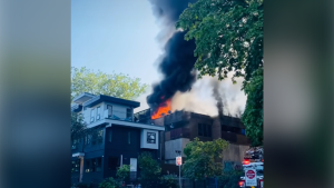 Building in Vancouver’s Mount Pleasant area completely engulfed by flames