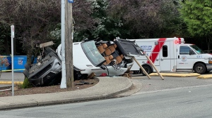 Police, ambulances respond to rollover crash in Surrey, B.C.
