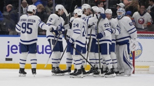 McMann, Woll lead Maple Leafs to 2-1 win over Islanders
