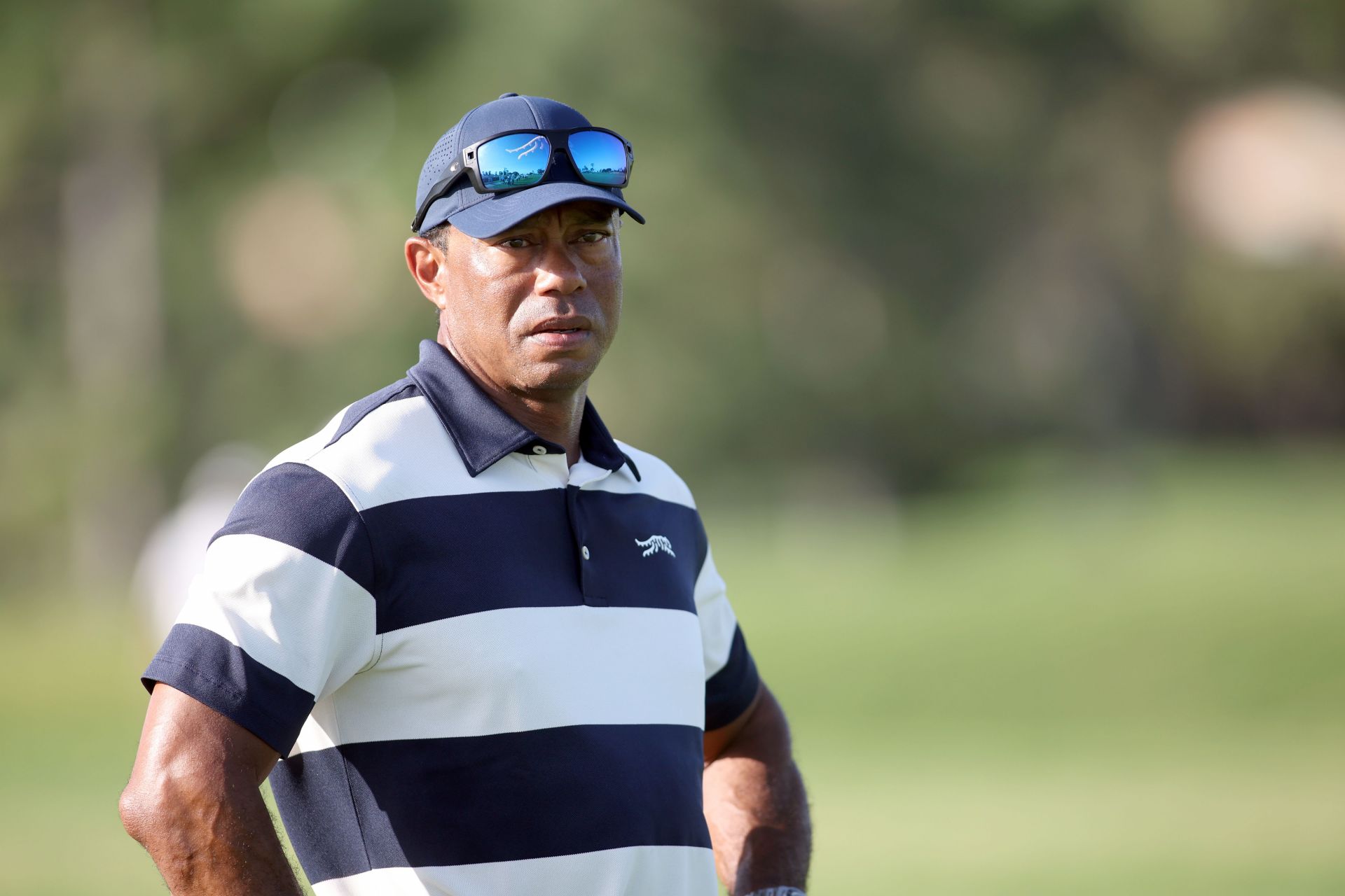 Tiger Woods celebrated a 'historic moment' at Cobbs Creek while away with injury